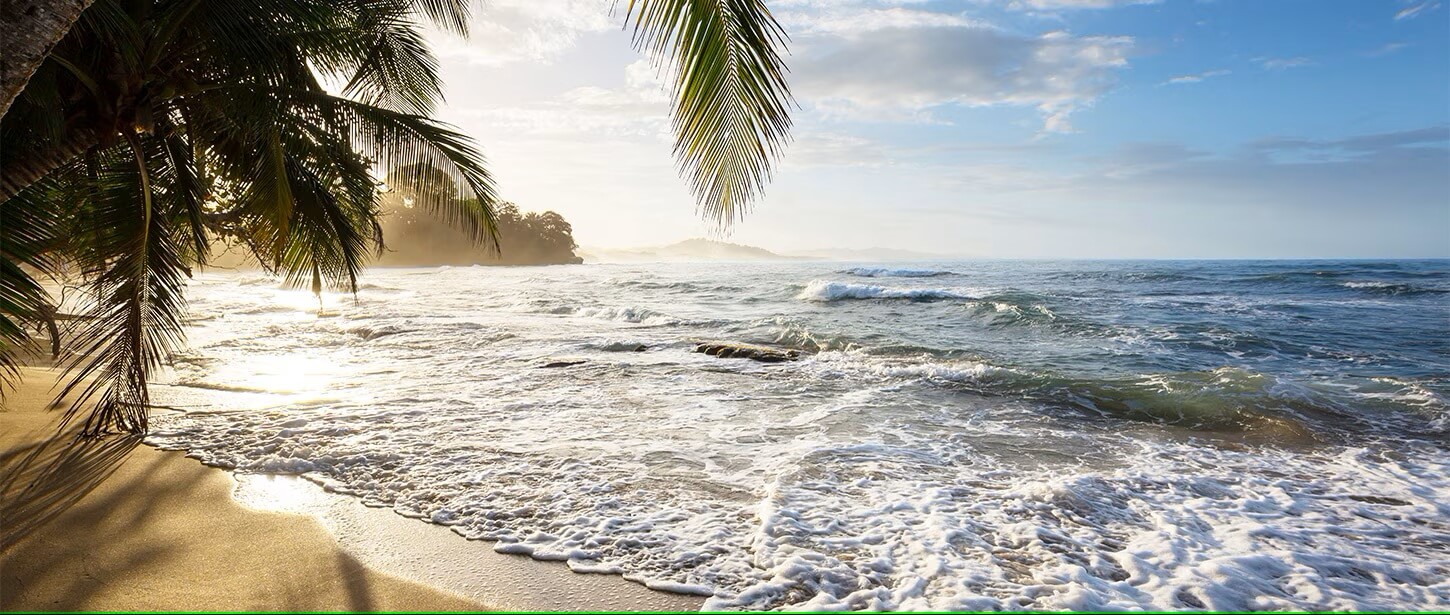 Traveler on beach at sunset